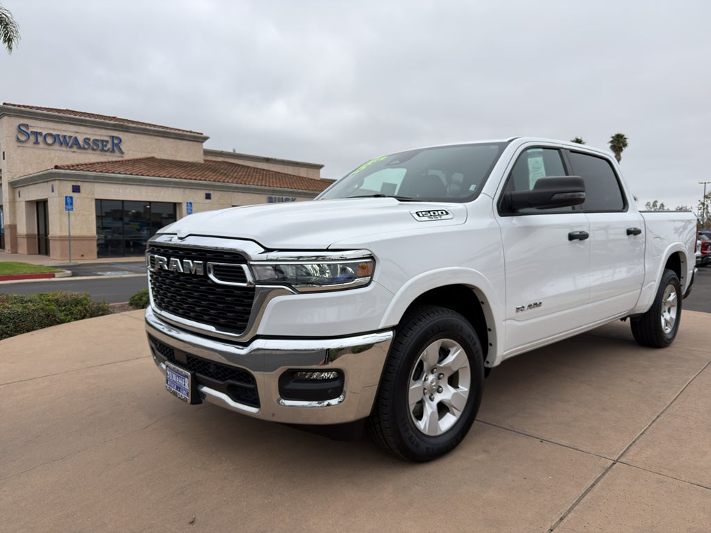 2025 RAM 1500 Big Horn 4x4 Crew Cab 5'7" Box in White — front three-quarter view