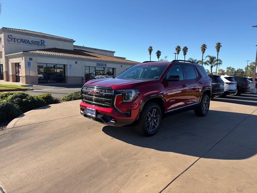 2026 GMC Terrain AT4 in Volcanic Red Tintcoat — front three-quarter view