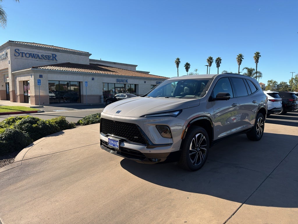 2026 Buick Enclave Sport Touring in Stone Metallic — front three-quarter view