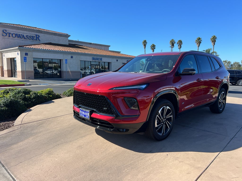 2026 Buick Enclave Sport Touring in Cherry Red Tintcoat — front three-quarter view